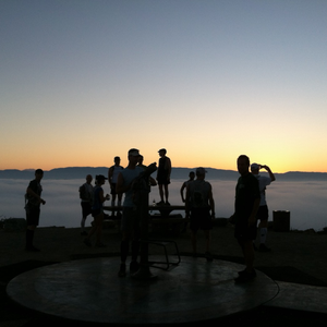 Runners on a hill at the crack of dawn.