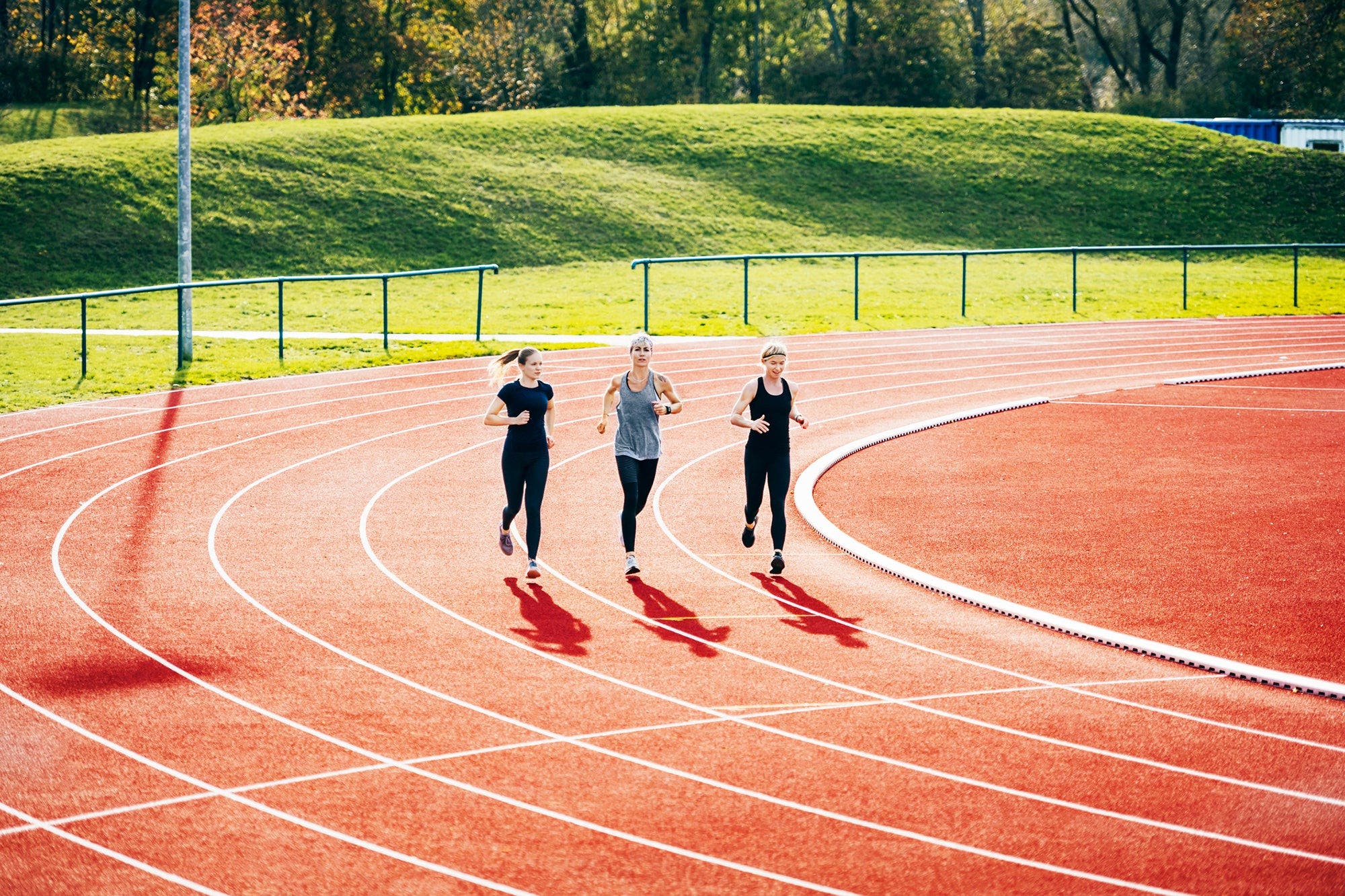 three women doing track workout