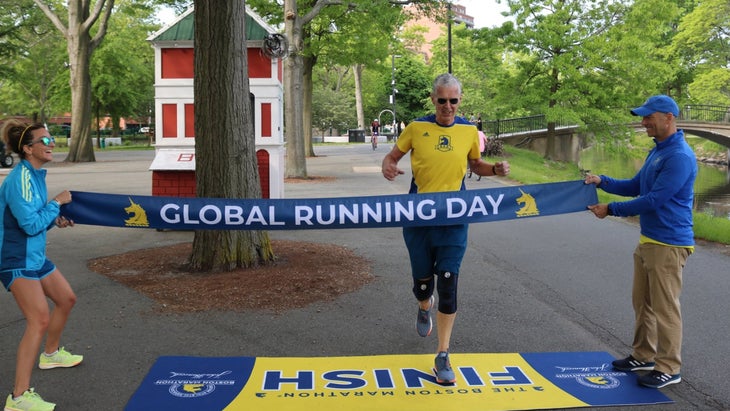 A man finishes a virtual race on Global Running Day.