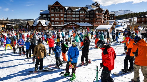 Skiers and snowboarders wait in line on opening day at Breckenridge Ski Resort in 2020.