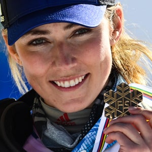 Mikaela Shiffrin celebrates on the podium during the medal ceremony after competing in the first and second run of the Women's Slalom on February 20, 2021 at the FIS Alpine World Ski Championships