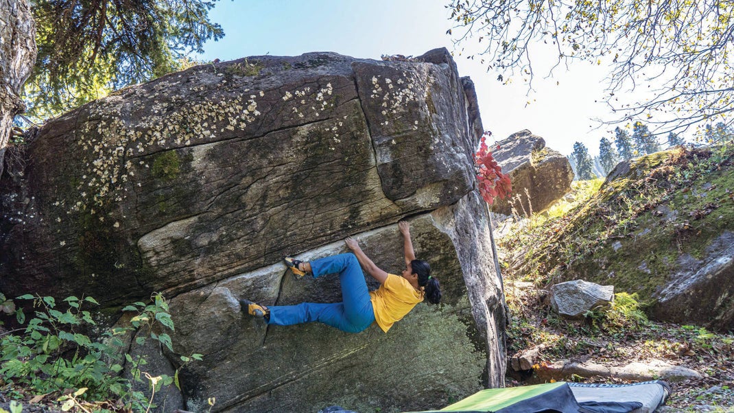 The author working Bleeder (6b+/V4) during the 2021 Climb Like A Woman event in Sethan, India. “Wide shoulders, bulky legs, no clean abs, and not-tall—I’ve always struggled in accepting my body image. However, I found enough strength from the women around me to accept myself,” she says.
