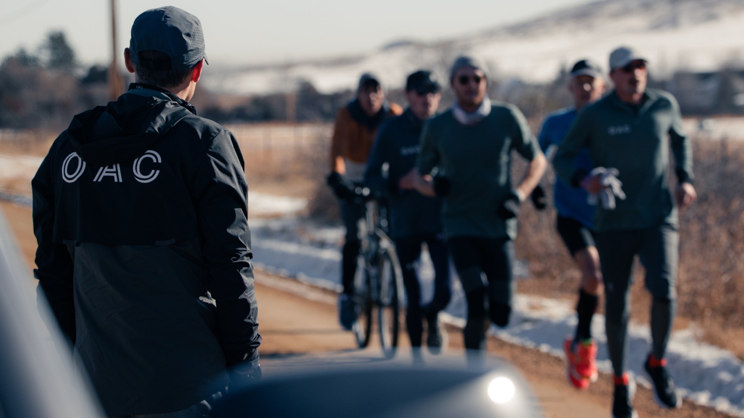 Dathan Ritzenhein watching over the On Athletics Club runners while they do a workout.