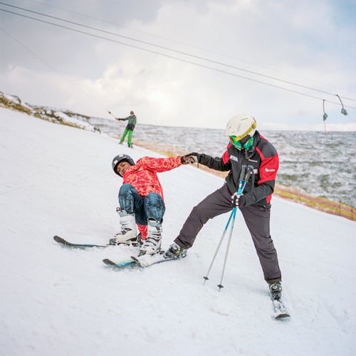 Ramabanta helps a first-timer on the steep upper slope