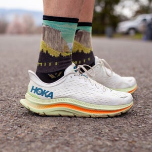 The author wearing a pair of Hoka Kawanas