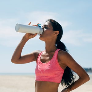 Runner drinking sports drink
