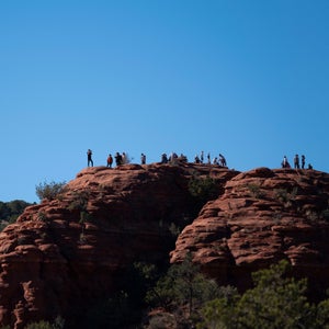 Tourists gather at the Airport Vortex one of many spiritual hot spots in and around the desert town of Sedona Arizona.