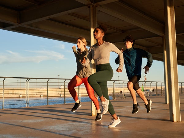 Three runners jogging at seaside