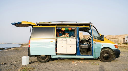 Resting in a van on the beach