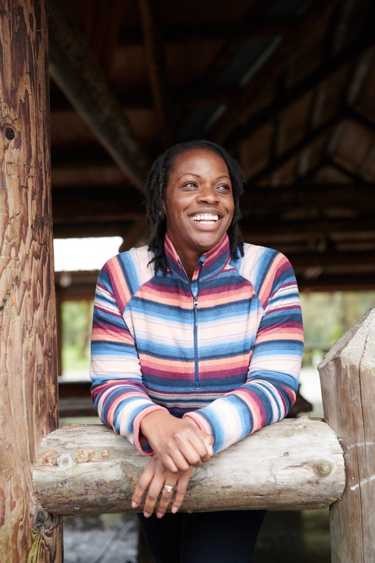 1-161656_BL_50457 Nailah Blades leans on a wooden post outside