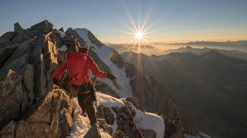 Rab pack being carried on a mountain