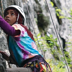 A young girl rock climbing