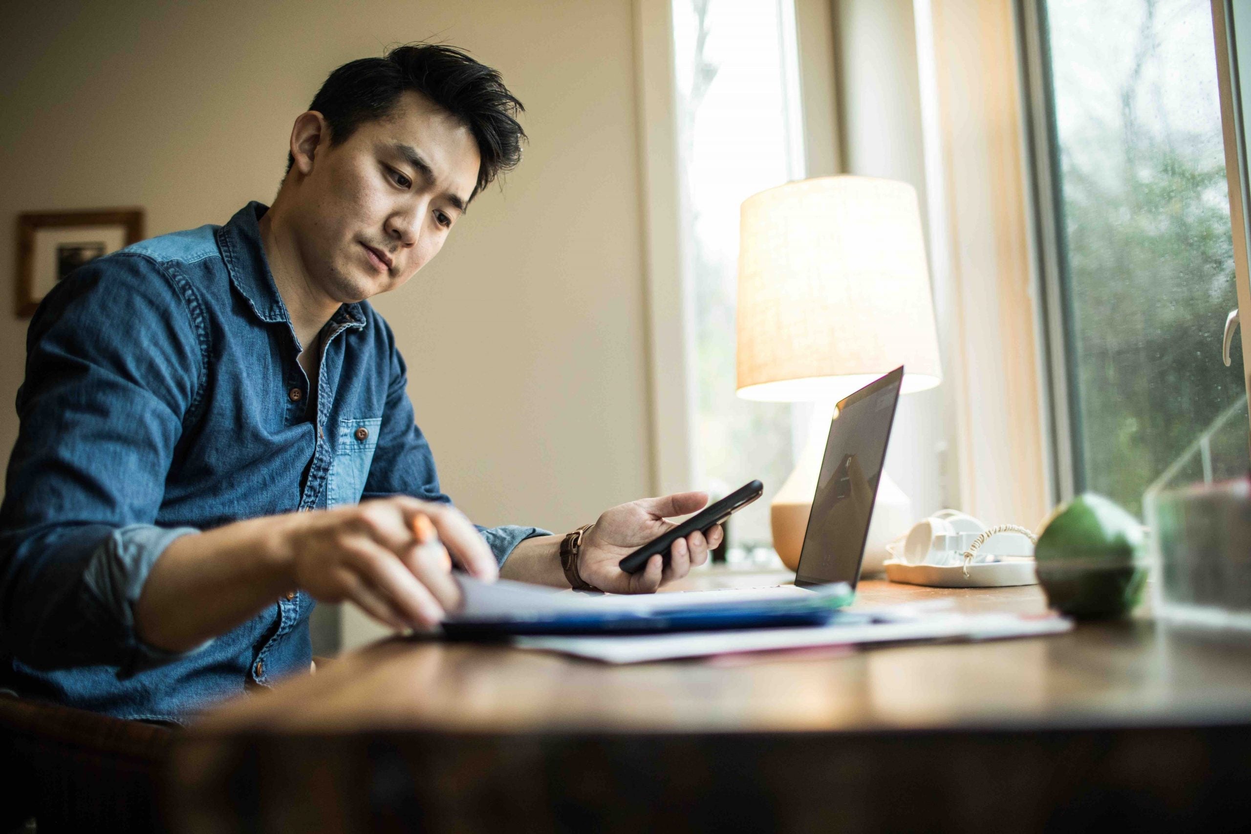Man at desk working on laptop