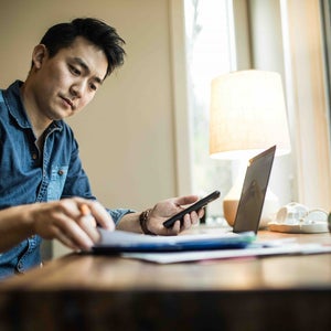 Man at desk working on laptop