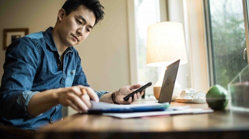 Man at desk working on laptop