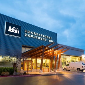 REI storefront at dusk