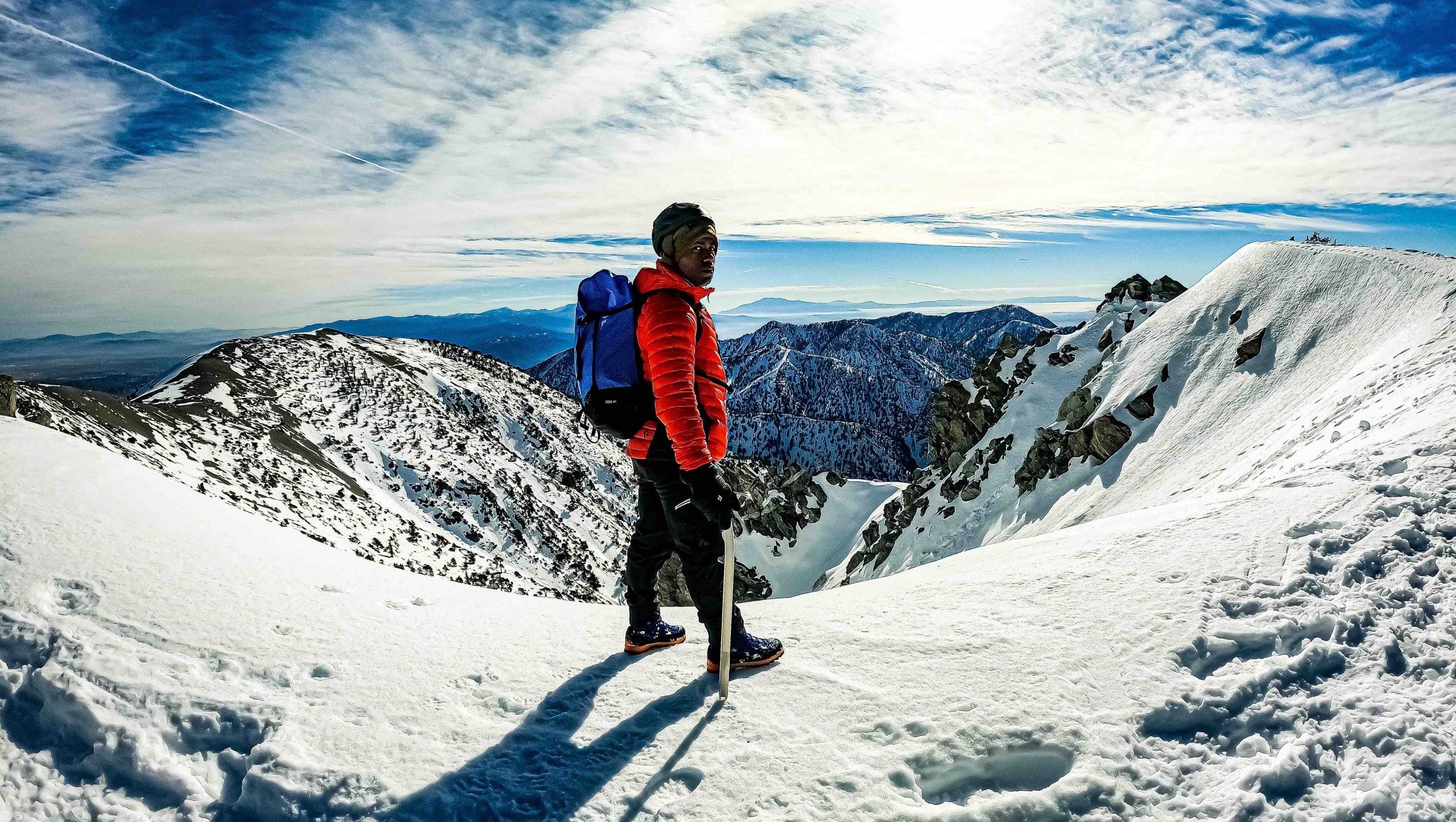 Andrew King on top of a snowy mountain