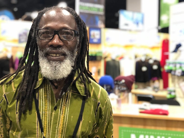 Black man with dreadlocks and glasses and green shirt \ Phil henderson, leader of the Fullc Circle Everest Expedition