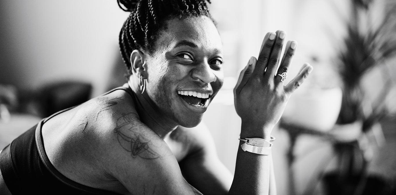 Women practicing yoga and smiling