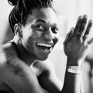Women practicing yoga and smiling