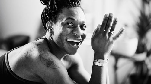 Women practicing yoga and smiling