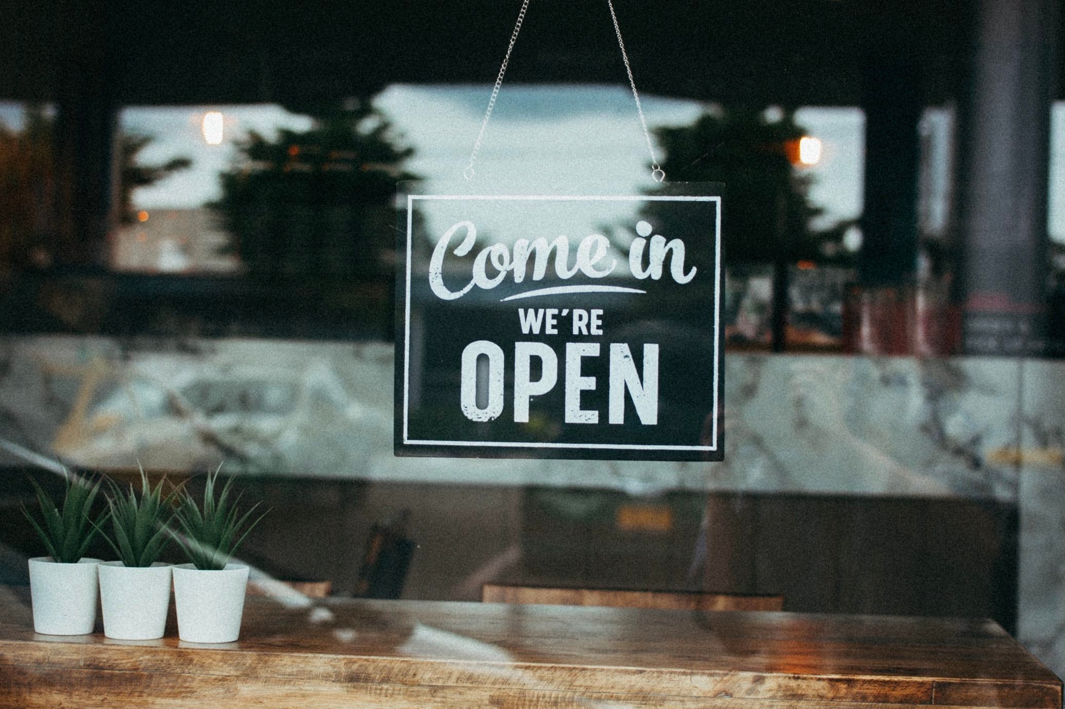 Open sign in store window