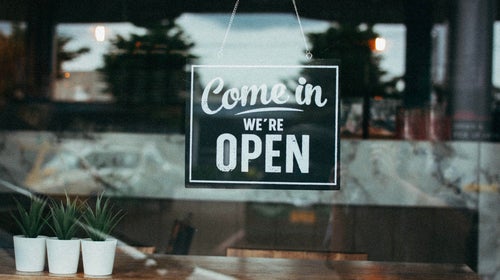 Open sign in store window