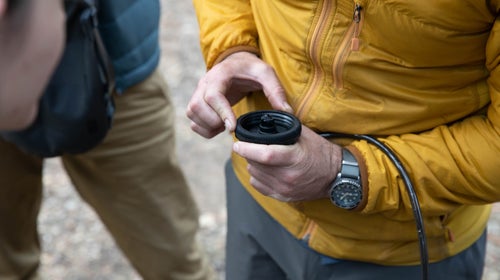 Closeup of a person holding a piece of equipment