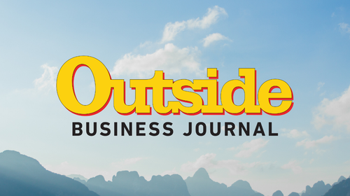 ԹϺ Business Journal logo superimposed on a lake