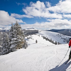 Skier standing at the top of Vail Resort
