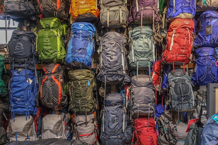 a colorful wall of backpacks at Backcountry Experience