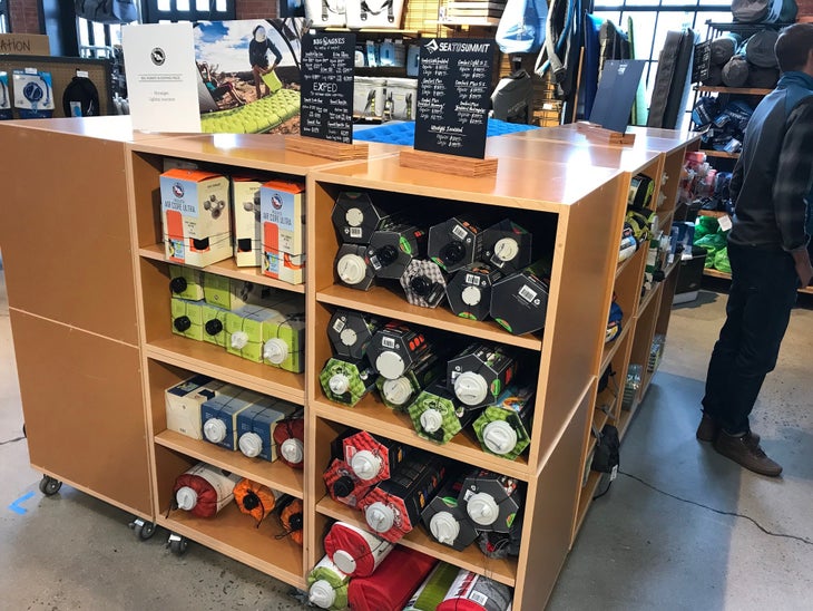 big agnes and sea to summit sleeping pads in retail display Big Agnes and Sea to Summit sleeping pads in retail display