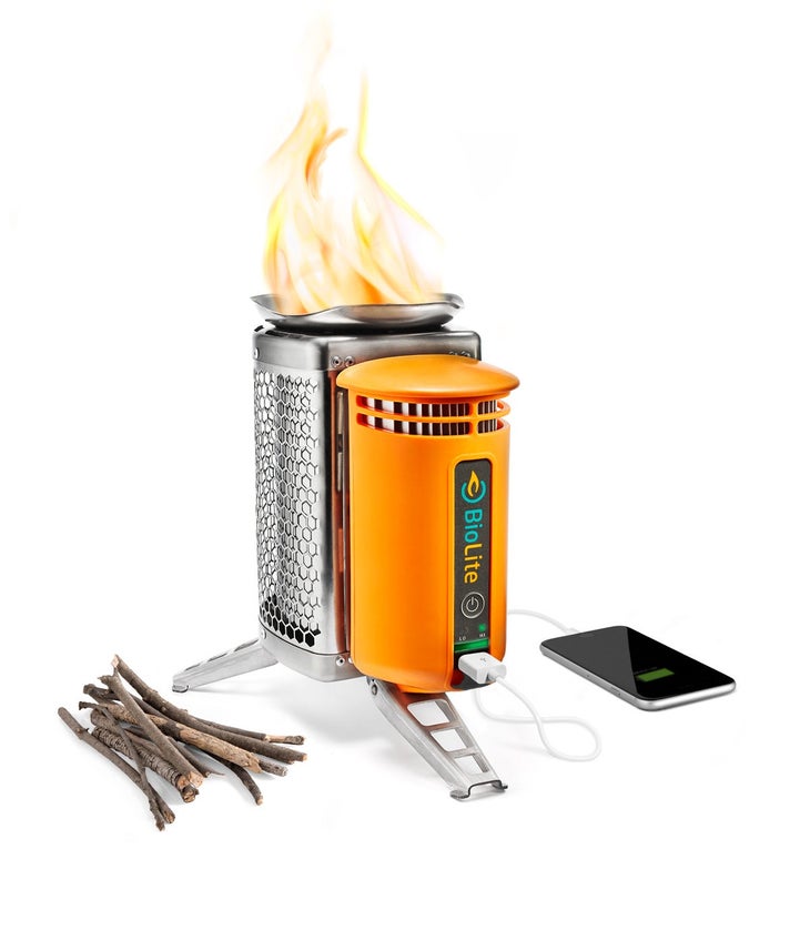 Biolite Camp Stove with pile of twigs, iPhone, flames
