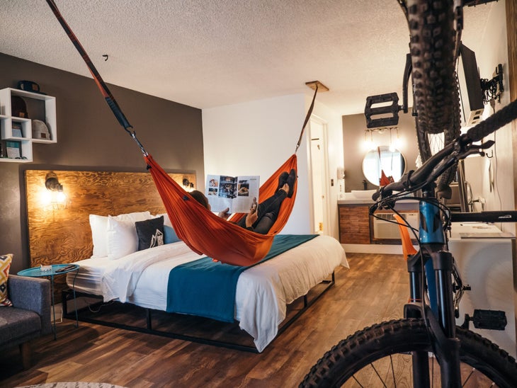 Copy of Room-SingleKing-PC-GarretVanSwearingen Person hanging in hammock in LOGE Bend room