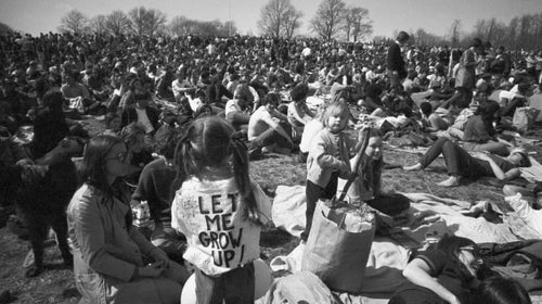 April 23, 1970, file photo, part of crowd observing Earth Day, including, youngster wearing 