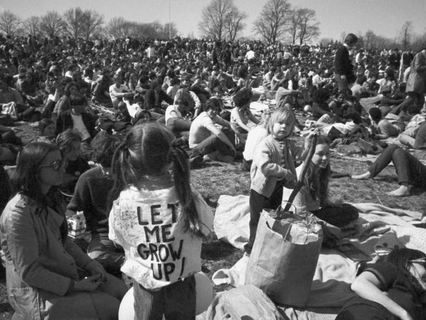 April 23, 1970, file photo, part of crowd observing Earth Day, including, youngster wearing 
