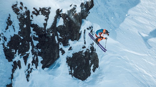 A skier mid-jump on the Freeride World Tour