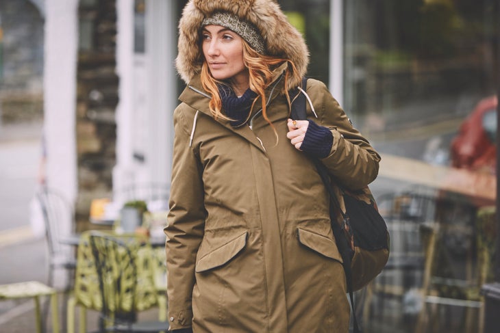 Woman wearing Craghoppers' Josefine jacket on a street in Lake District, England.