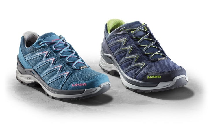 Two low-cut Lowa hiking shoes, one turquoise with pink accents, one navy blue with green accents