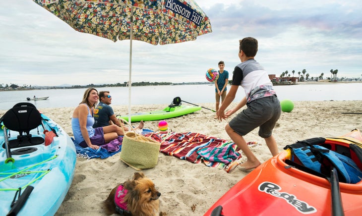 Family playing on beach with kids prodigy kayak | family paddlesports