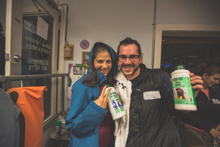 Nikwax retailer event: Two people holding Nikwax products