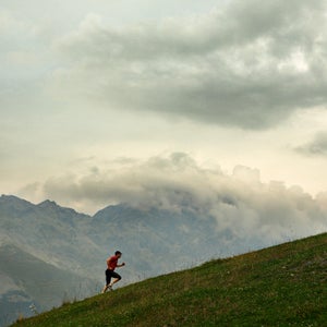 A man jogging in the mountains, Italy