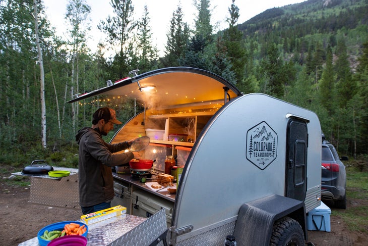 rx colorado teardrop cooking Colorado Teardrops RV with person cooking out of the back