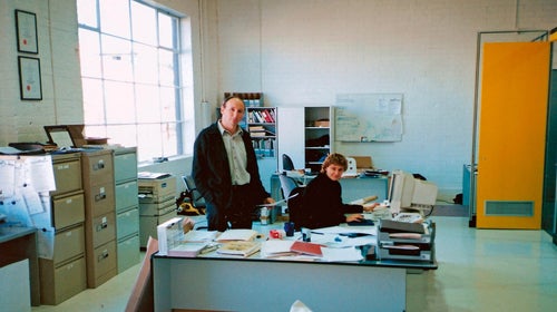 Two people sitting in an office