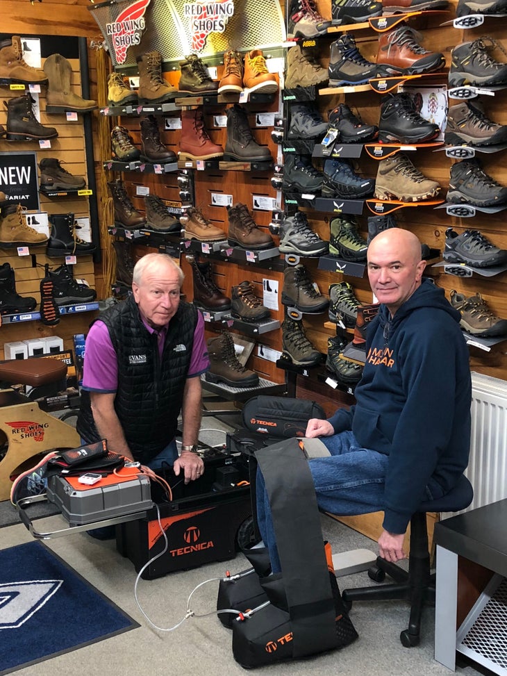 Tecnica boot fitting at red wings shoes A bootfitter at Red Wing Shoes tends to a customer with the trolley C.A.S. system.