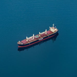 Freighter ship in the middle of blue water