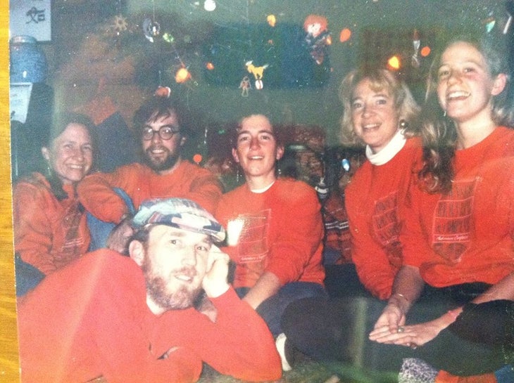 townsend Bertram & Co staff Six people in matching red sweatshirts posing in front of a Christmas tree
