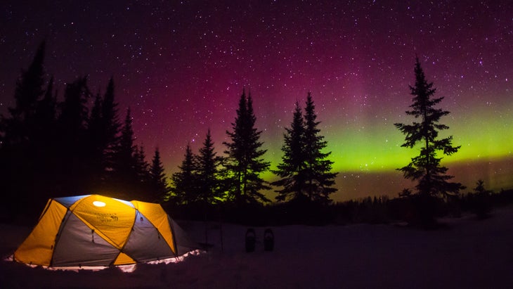 Tent camping under the northern lights