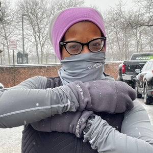 Woman wearing mittens in snow
