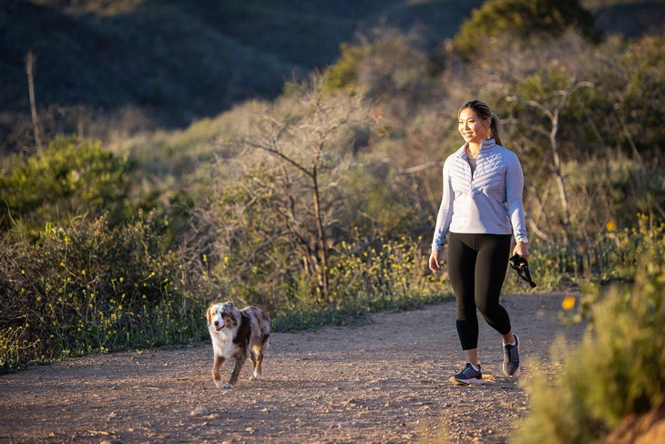 Chloe Kim hikes with her dog Reese, a miniature Australian shepherd.